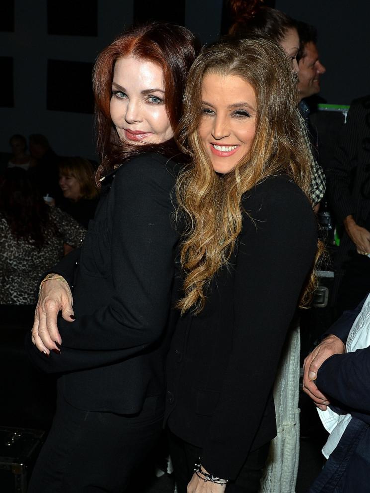 PHOTO: Priscilla Presley celebrates backstage with her daughter Lisa Marie Presley after Lisa Marie's performance during the 14th Annual Americana Music Festival & Conference on Sept. 20, 2013 in Nashville.