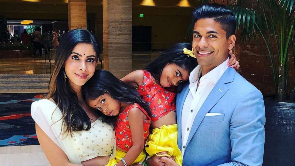 PHOTO: Priya Bhola Rathod, an Indian-American mother of two based in Dallas, Texas, smiles alongside her two daughters and husband. 