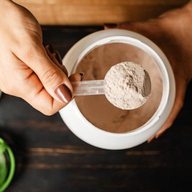 PHOTO: In this undated file photo, a woman scoops a portion of whey protein powder.
