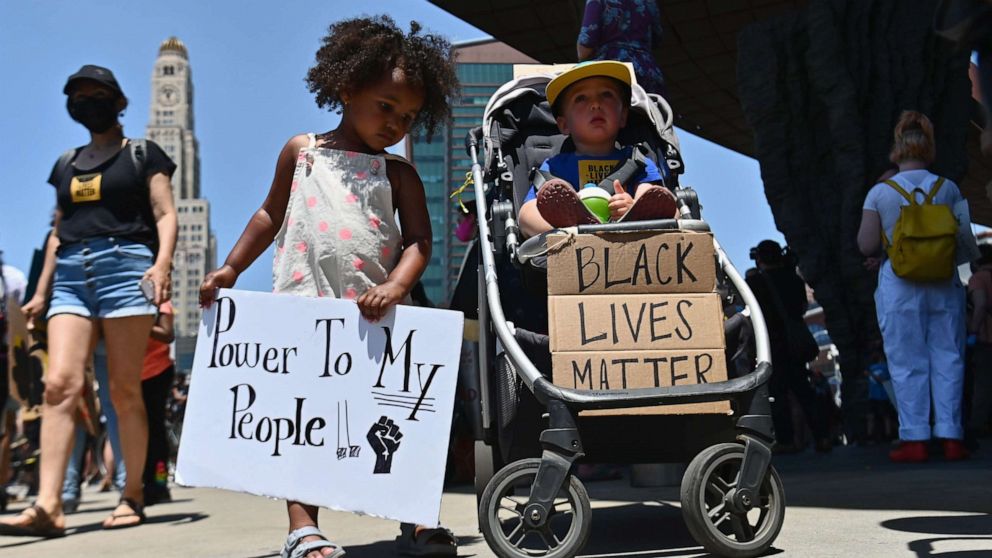 PHOTO: Families participate in a children's march in solidarity with the Black Lives Matter movement and national protests against police brutality on June 9, 2020 in the Brooklyn Borough of New York City.