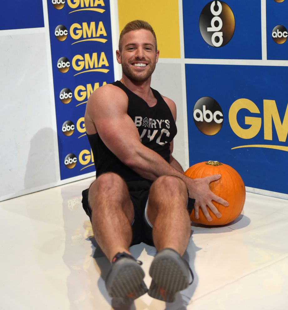 PHOTO: Barry's Bootcamp trainer Josey Greenwell demonstrates the pumpkin seated Russian twist.