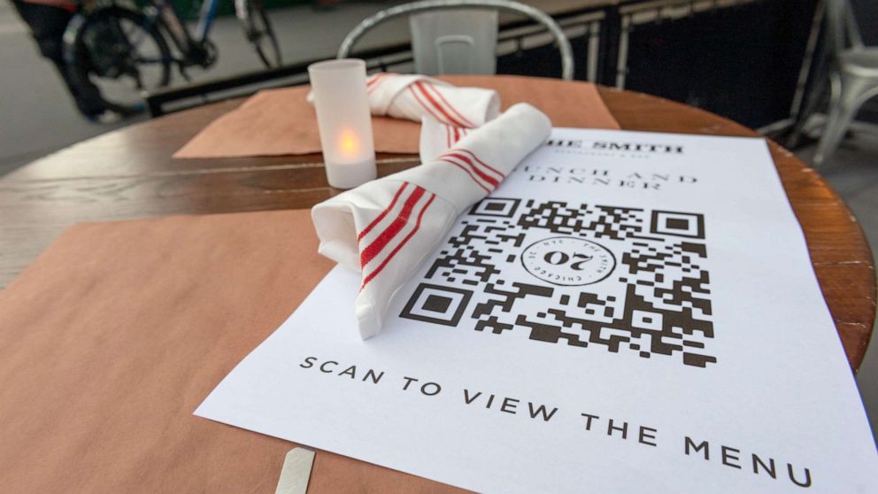 PHOTO: A paper menu with a QR code to encourage touchless ordering is on display at The Smith's outdoor seating near Lincoln Center as New York City moves into Phase 3 of re-opening, on July 13, 2020.