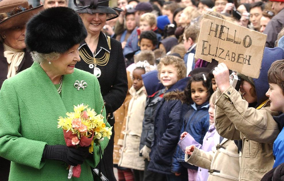 PHOTO: Queen Elizabeth walks past children from St Michael on the Mount School in Bristol, England, Feb. 25, 2005. 