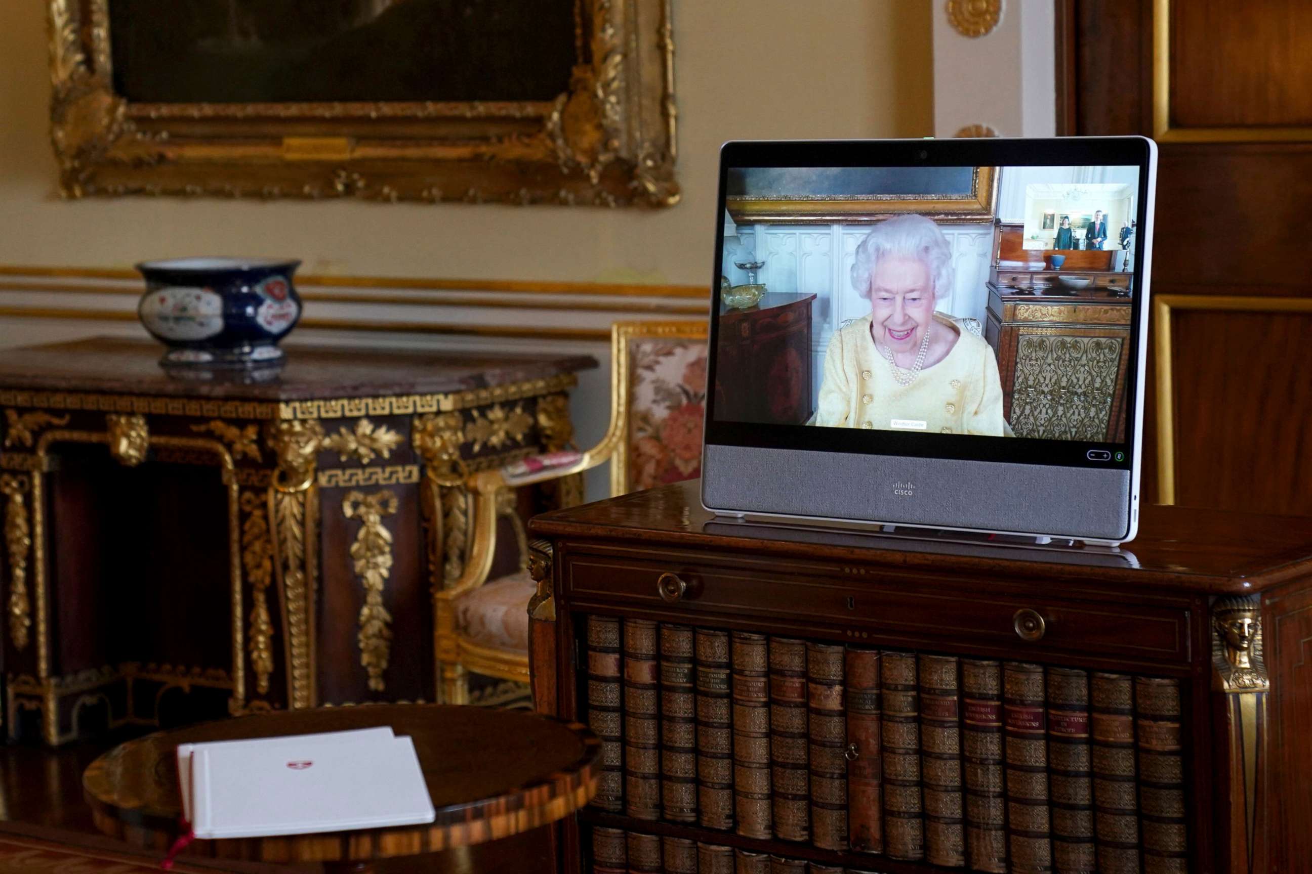 PHOTO: Queen Elizabeth II appears on a screen via videolink from Windsor Castle, where she is in residence, during a virtual audience at Buckingham Palace, London,  Oct. 26, 2021.