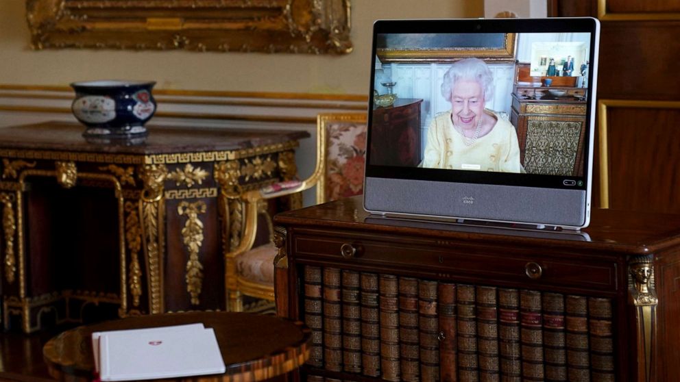 PHOTO: Queen Elizabeth II appears on a screen via videolink from Windsor Castle, where she is in residence, during a virtual audience at Buckingham Palace, London,  Oct. 26, 2021.