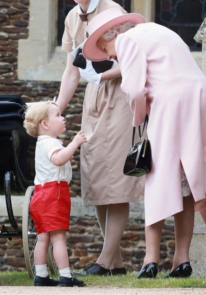 PHOTO: Queen Elizabeth II and Prince George leave the Church of St Mary Magdalene on the Sandringham Estate for the Christening of Princess Charlotte of Cambridge, July 5, 2015, in Kings Lynn, England.