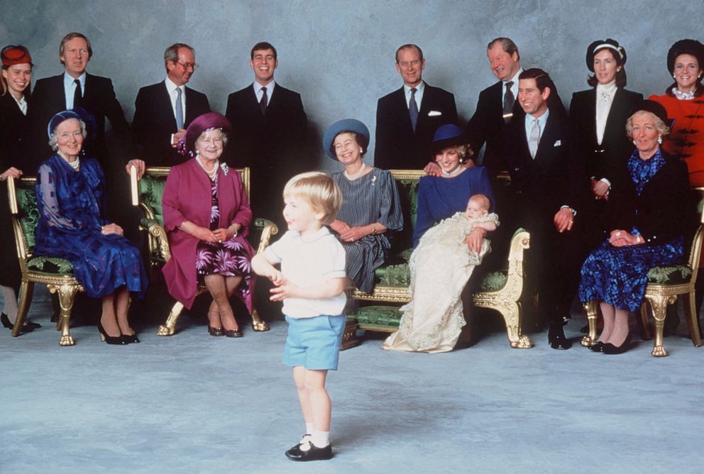 PHOTO: Surrounded by Royal relatives and godparents who are amused at the antics of young Prince William, Prince Harry is christened at Windsor Castle on December 21, 1984 in Windsor, England.