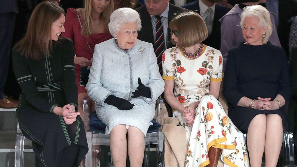 PHOTO: Queen Elizabeth II sits next to Anna Wintour and Caroline Rush (left), and royal dressmaker Angela Kelly at a show during London Fashion Week, on February 20, 2018. 
