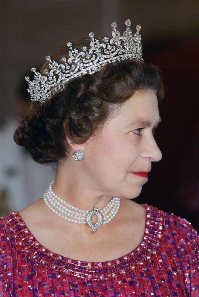 PHOTO: Queen Elizabeth II wears a four strand diamond and pearl choker with "Granny's Tiara" to an engagement on Nov. 16, 1983 in Bangladesh.