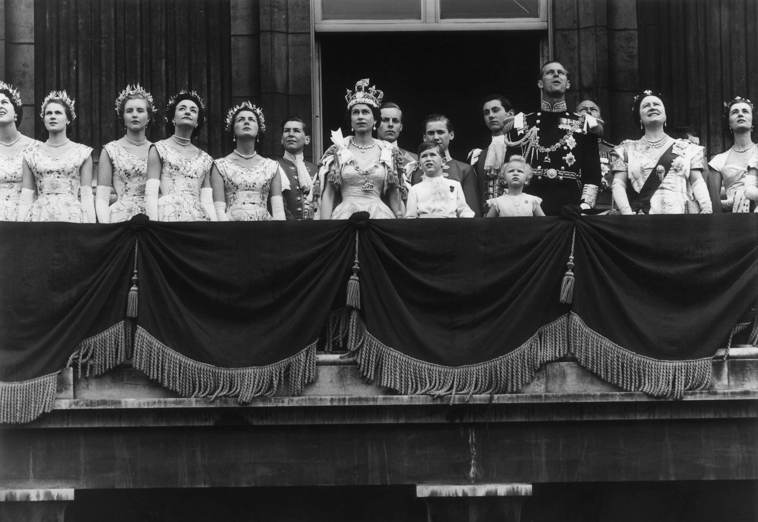 PHOTO: The newly crowned Queen Elizabeth II waves to the crowd from the balcony at Buckingham Palace following her Coronation, June 2, 1953, in London.