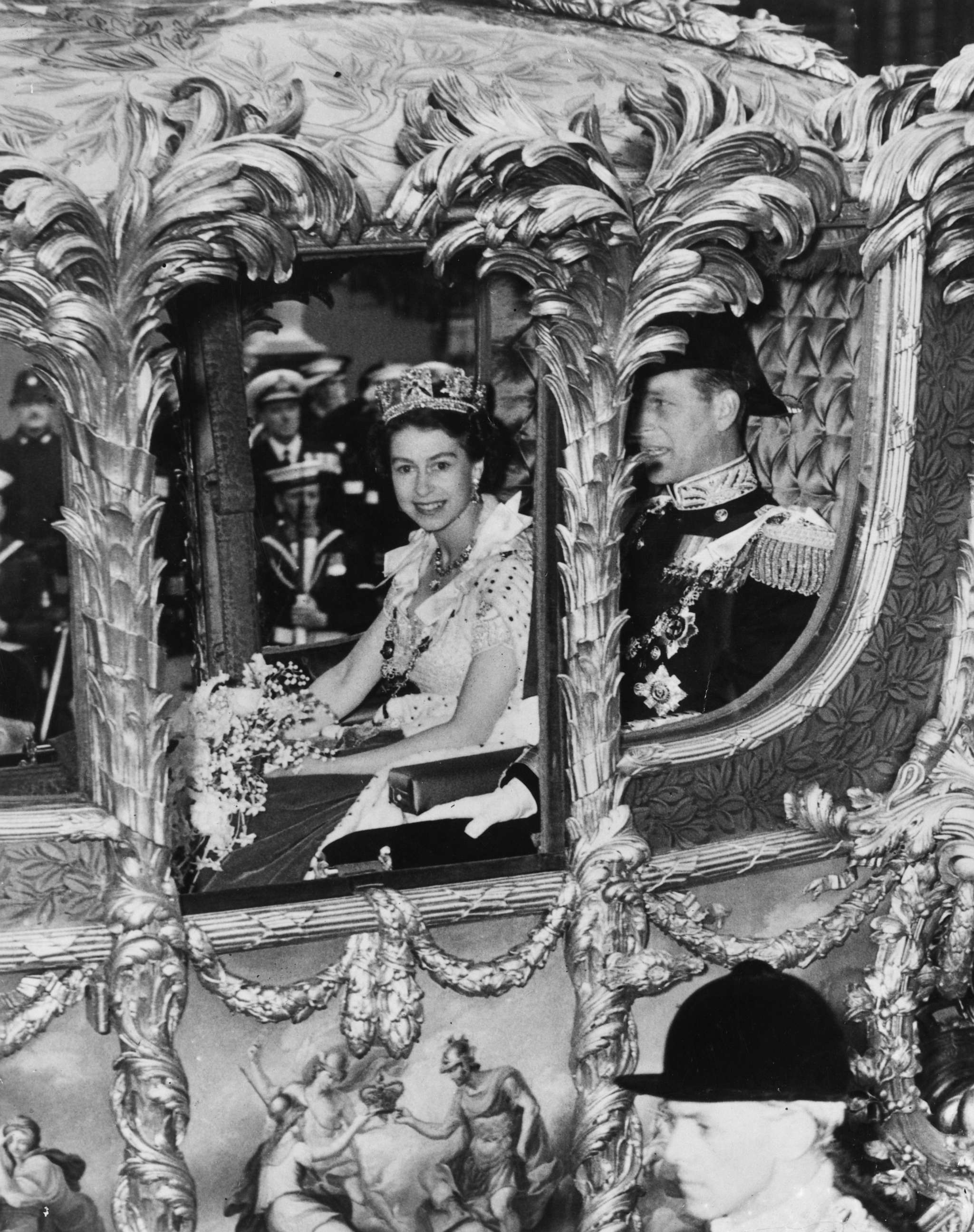 PHOTO: Queen Elizabeth II with Prince Philip, Duke of Edinburgh looks out from her Coronation Coach as she makes her way to Westminster Abbey for Coronation ceremony, June 2, 1953 in London.