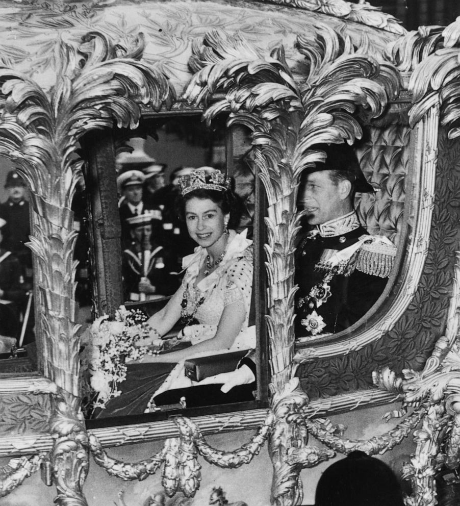 PHOTO: Queen Elizabeth II with Prince Philip, Duke of Edinburgh looks out from her Coronation Coach as she makes her way to Westminster Abbey for Coronation ceremony, June 2, 1953 in London.