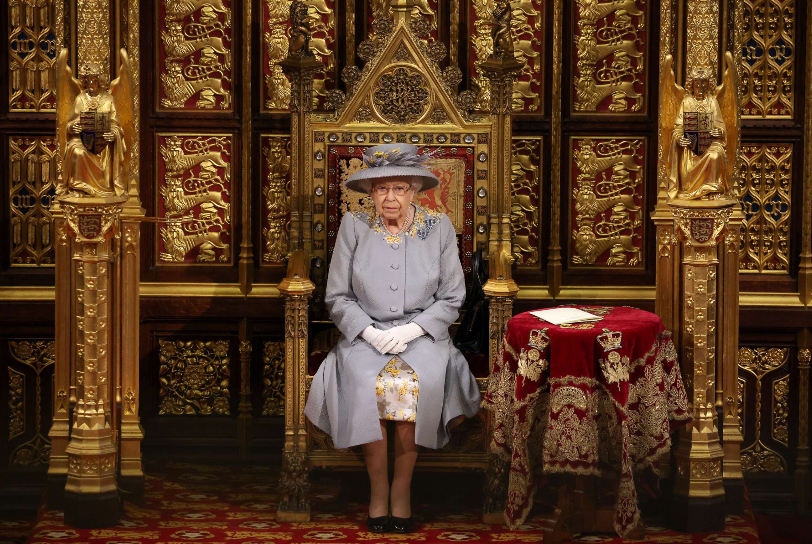PHOTO: Queen Elizabeth II sits in the House of Lord's Chamber during the State Opening of Parliament at the House of Lords ahead of the Queen's Speech on May 11, 2021, in London.