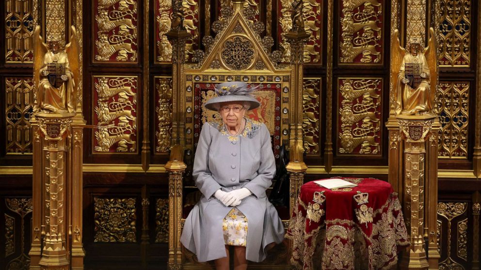 PHOTO: Queen Elizabeth II sits in the House of Lord's Chamber during the State Opening of Parliament at the House of Lords ahead of the Queen's Speech on May 11, 2021, in London.