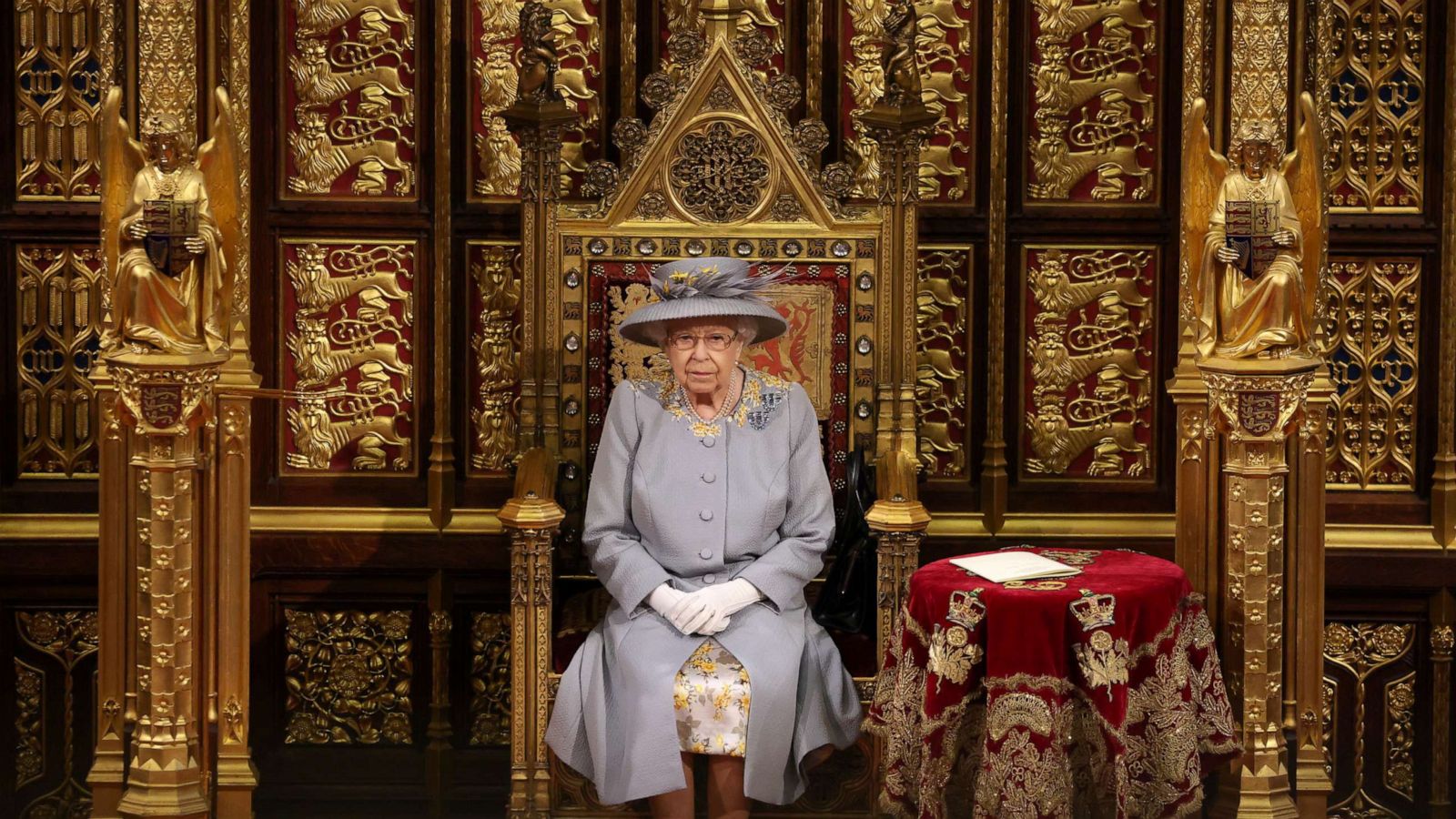 PHOTO: Queen Elizabeth II sits in the House of Lord's Chamber during the State Opening of Parliament at the House of Lords ahead of the Queen's Speech on May 11, 2021, in London.