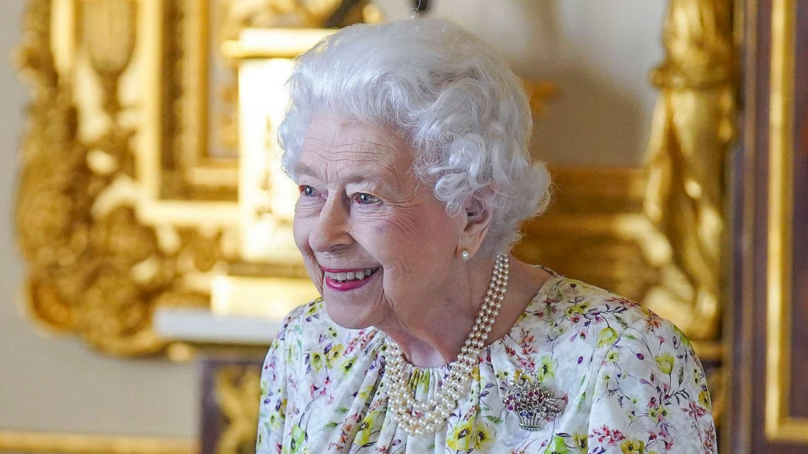 PHOTO: Queen Elizabeth II arrives to view a display of artefacts from British craftwork company, Halcyon Days, to commemorate the company's 70th anniversary in the White Drawing Room at Windsor Castle, on March 23, 2022 in Windsor, England.