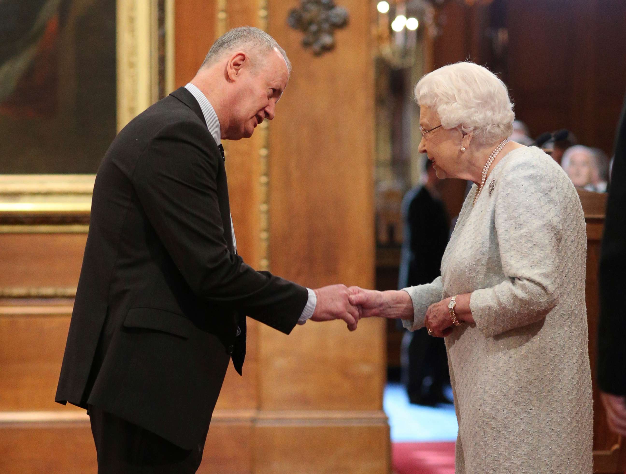 PHOTO: FILE PHOTO: Frank Mullane is made an MBE (Member of the Order of the British Empire) by Queen Elizabeth II for services to families affected by domestic homicide at Windsor Castle, in Windsor, U.K., March 22, 2019.