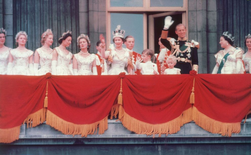 PHOTO: The Duke of Edinburgh and the newly crowned Queen Elizabeth II wave to the crowd from the balcony at Buckingham Palace in London, June 2, 1953.