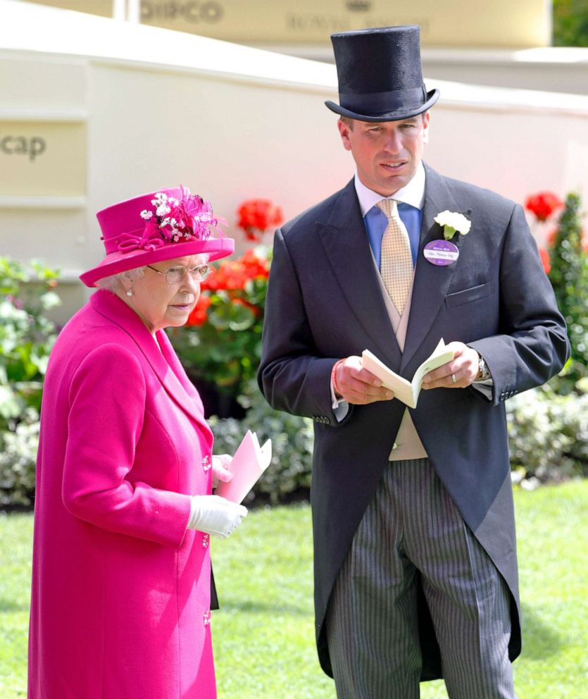 PHOTO: Queen Elizabeth II and her grandson Peter Phillips watch the horses in the parade ring on Day 4 of Royal Ascot at Ascot Racecourse on June 20, 2014 in Ascot, England.