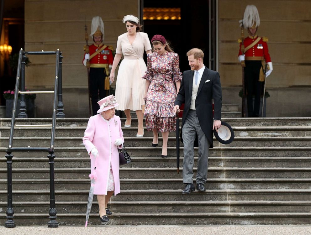 PHOTO: Queen Elizabeth II, Princess Eugenie, Princess Beatrice and Prince Harry, Duke of Sussex, attend the Royal Garden Party at Buckingham Palace on May 29, 2019 in London.