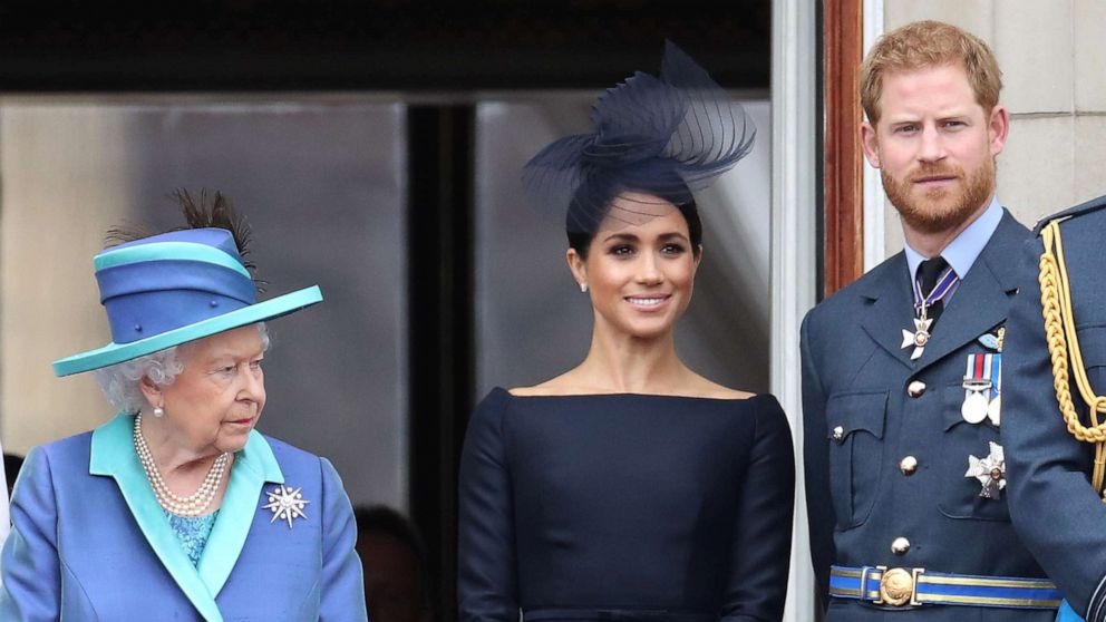 PHOTO: Queen Elizabeth II, Prince Harry, Duke of Sussex and Meghan, Duchess of Sussex on the balcony of Buckingham Palace as the Royal family attend events to mark the Centenary of the RAF, July 10, 2018, in London.