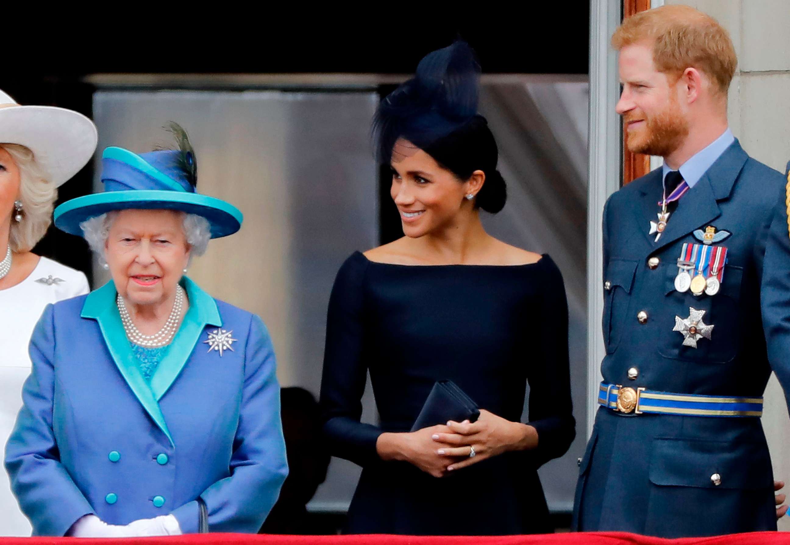 PHOTO: In this July 10, 2018, file photo, Queen Elizabeth II, Meghan, Duchess of Sussex, and  Prince Harry, Duke of Sussex stand on the balcony of Buckingham Palace in London to watch a military fly-past to mark the centenary of the Royal Air Force.