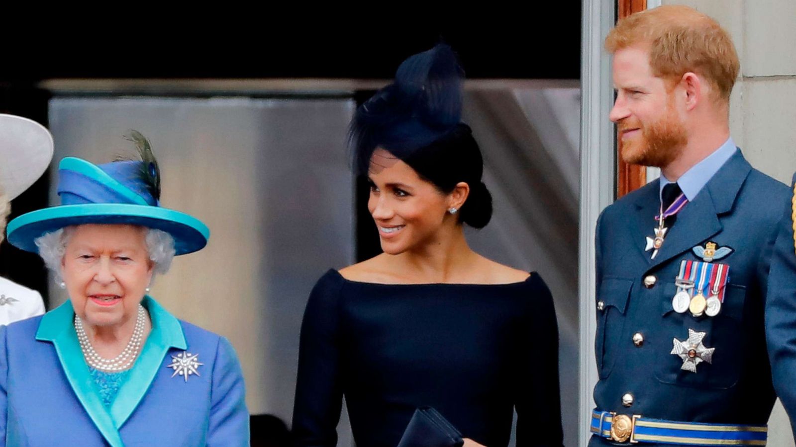 PHOTO: In this July 10, 2018, file photo, Queen Elizabeth II, Meghan, Duchess of Sussex, and Prince Harry, Duke of Sussex stand on the balcony of Buckingham Palace in London to watch a military fly-past to mark the centenary of the Royal Air Force.