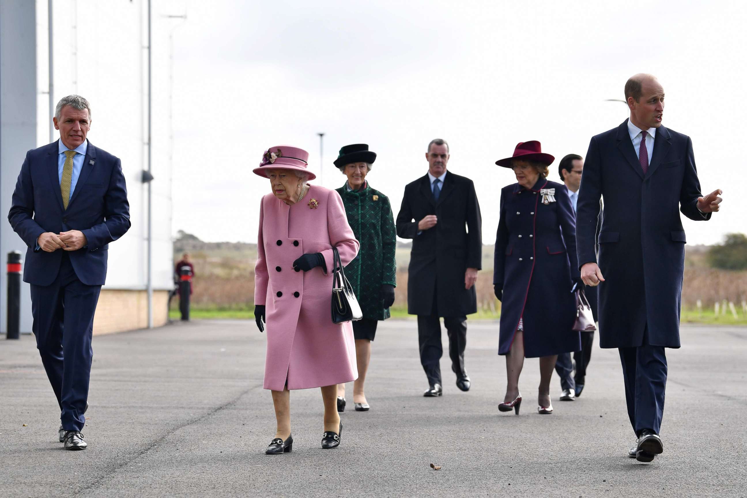 PHOTO: Britain's Queen Elizabeth II (C) and Britain's Prince William, Duke of Cambridge (R) arrive with Dstl Chief Executive Gary Aitkenhead (L) at Porton Down science park near Salisbury, southern England, on Oct. 15, 2020.