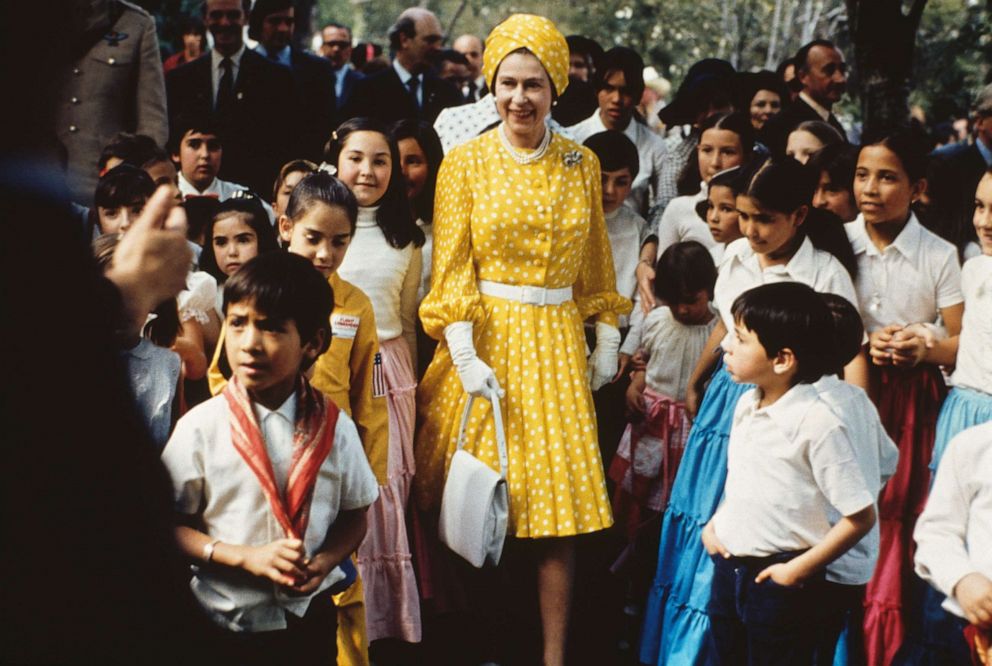 PHOTO: Queen Elizabeth II visits with a group of local children during her state visit to Mexico, March 1, 1975.