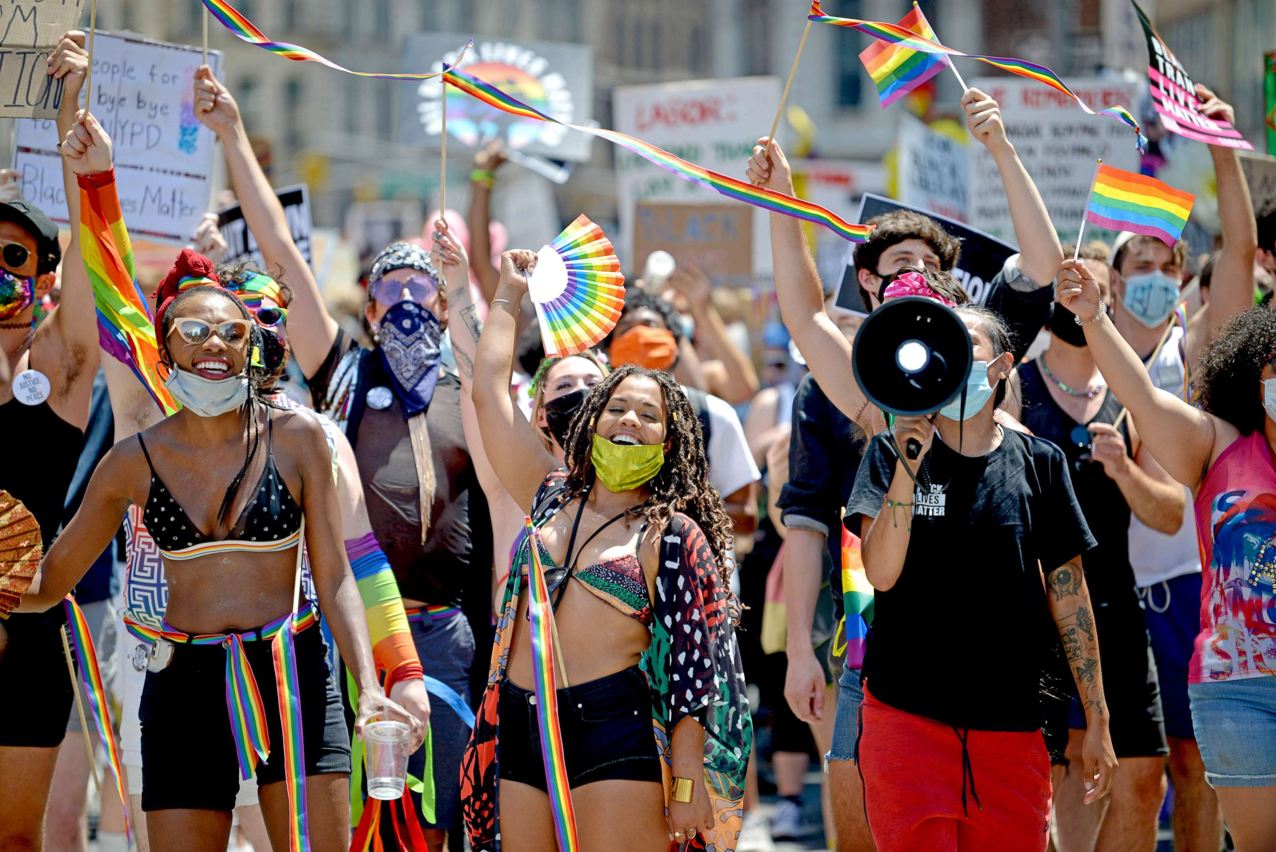 PHOTO: Marchers are seen smiling and waving during the Queer Liberation March for Black Lives & Against Police Brutality on June 28, 2020 in New York City.