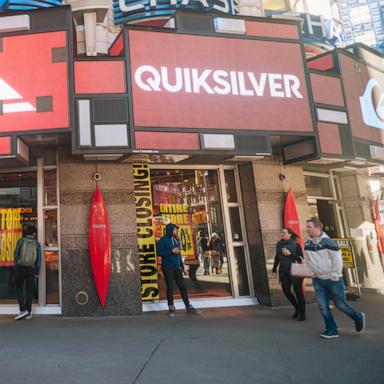 PHOTO: In this Nov. 8, 2015, file photo, big discounts on merchandise and fixtures are advertised in the Quicksilver store in Times Square in New York.