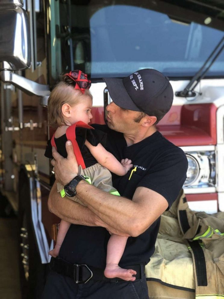 PHOTO: Adam Walker of Gilbert, Arizona, is a firefighter with the Casa Grande Fire Department. Here is is seen in an undated photo with his daughter, Quinn, 2.
