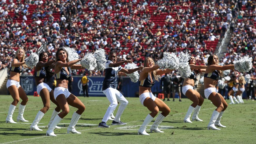 PHOTO: Quinton Peron performs with the Los Angeles Rams cheerleaders during the game between the Los Angeles Rams and the Oakland Raiders at Los Angeles Memorial Coliseum, Aug. 18, 2018, in Los Angeles.