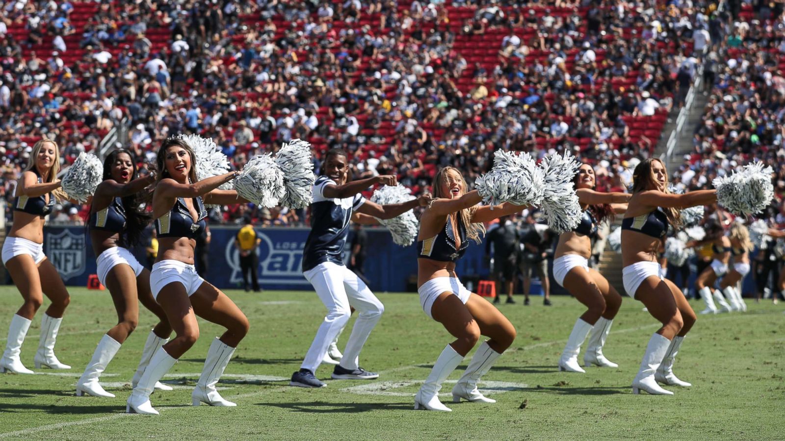 PHOTO: Quinton Peron performs with the Los Angeles Rams cheerleaders during the game between the Los Angeles Rams and the Oakland Raiders at Los Angeles Memorial Coliseum, Aug. 18, 2018, in Los Angeles.