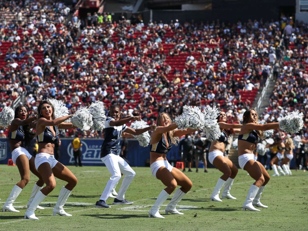 PHOTO: Quinton Peron performs with the Los Angeles Rams cheerleaders during the game between the Los Angeles Rams and the Oakland Raiders at Los Angeles Memorial Coliseum, Aug. 18, 2018, in Los Angeles.