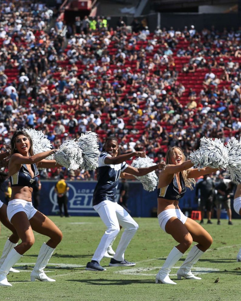 PHOTO: Quinton Peron performs with the Los Angeles Rams cheerleaders during the game between the Los Angeles Rams and the Oakland Raiders at Los Angeles Memorial Coliseum, Aug. 18, 2018, in Los Angeles.