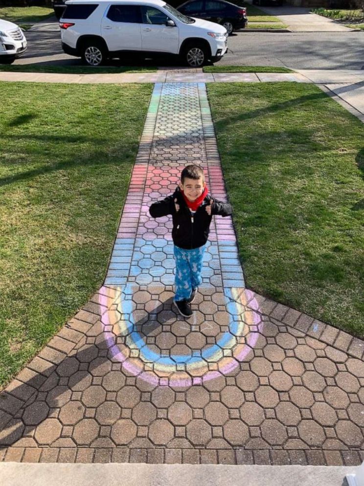 PHOTO: Rylan Nestro, 5, stands proud in front of a chalk rainbow he created to spread hope and joy in his Long Island, New York, community amid the coronavirus crisis.