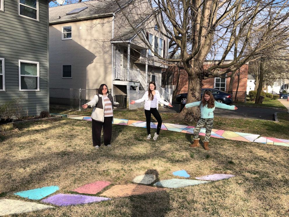 PHOTO: Rachel Alford stands with her children and the rainbow chalk they created to spread hope and joy in their Long Island, New York, community amid the coronavirus crisis.