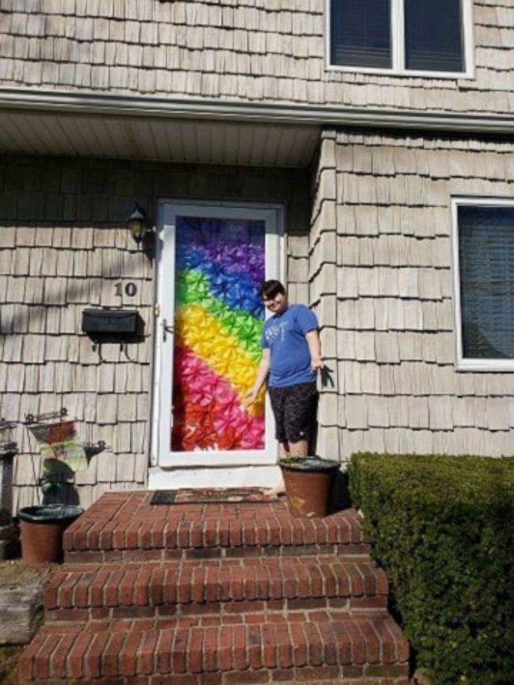 PHOTO: Caleb Cassano, 14, stands near a rainbow he created to spread hope and joy in his Long Island, New York, community amid the coronavirus crisis.