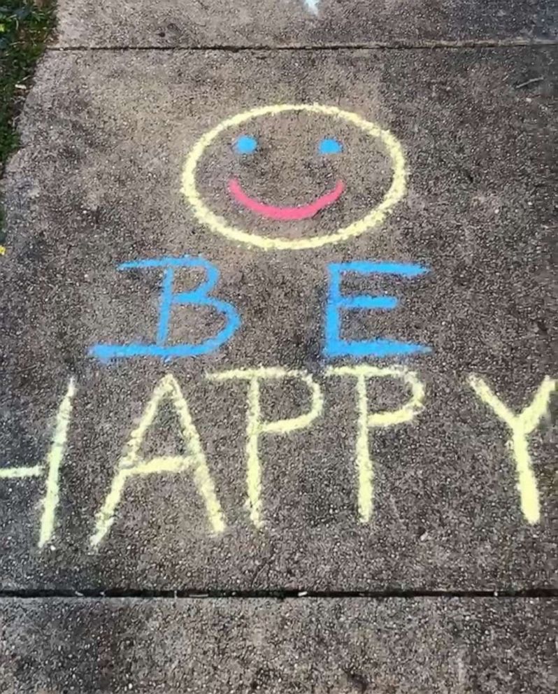 PHOTO: A smile face appears on a sidewalk in a New York neighborhood amid the coronavirus crisis.