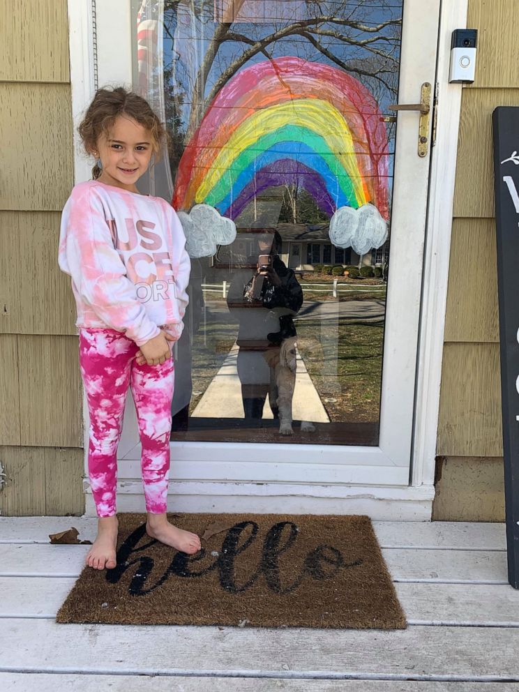 PHOTO: Londyn Donnelly, 6, stands beside a painted rainbow she created to spread hope and joy in her Long Island, New York, community amid the coronavirus crisis.