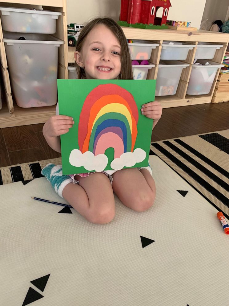 PHOTO: Izzy Marino, 4-and-a-half, holds a rainbow she created to spread hope and joy in her Long Island, New York, community amid the coronavirus crisis.
