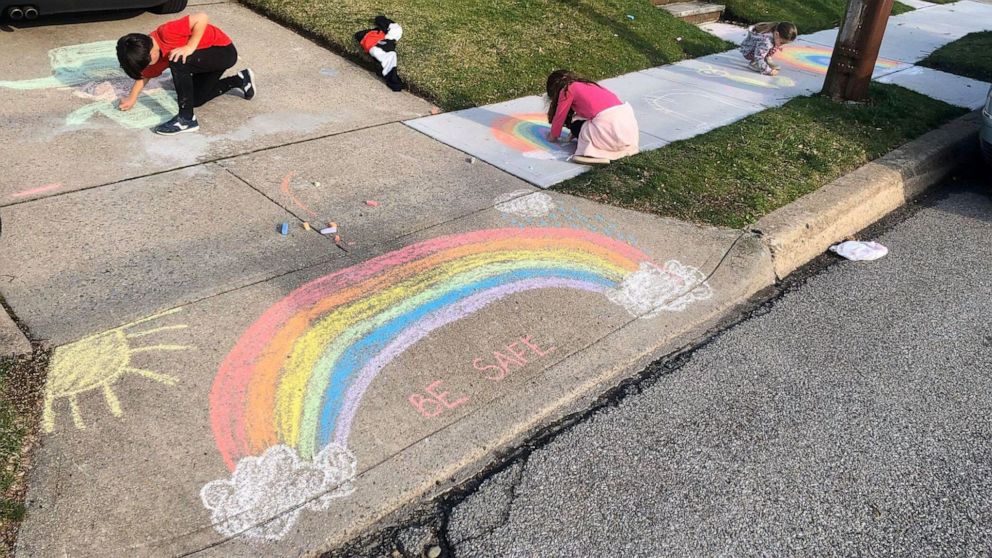 PHOTO: Michelle Faisca's children draw rainbows to spread joy and encouragement outside their home of Mineola, New York, amid the coronavirus pandemic.