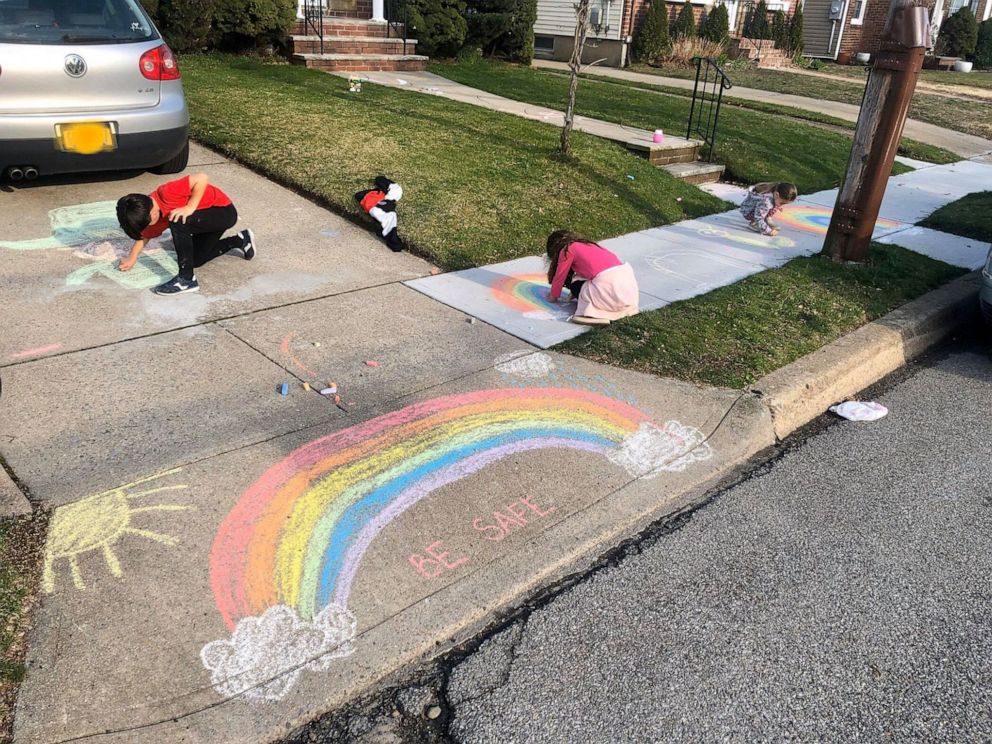PHOTO: Michelle Faisca's children draw rainbows to spread joy and encouragement outside their home of Mineola, New York, amid the coronavirus pandemic.