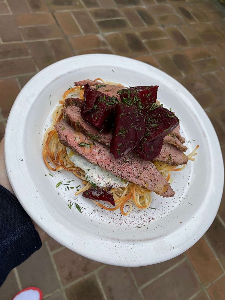 PHOTO: Chef Richard Blais holds his plate of ramen noodle cakes topped with sour cream, flank steak, pickled beets and fresh chives.