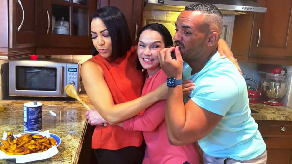 PHOTO: Stephanie Ramos cooks plantains with her mom and brother.
