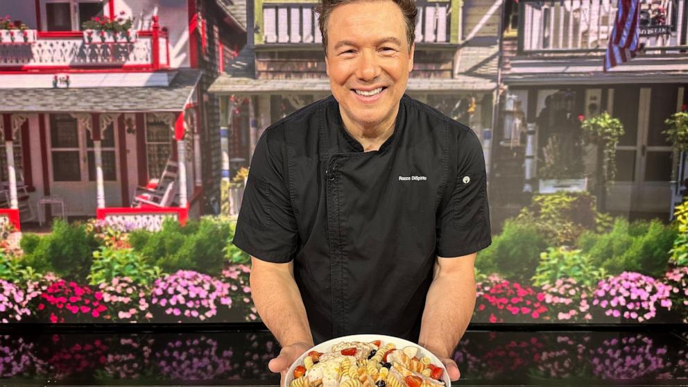 PHOTO: Chef Rocco DiSpirito holds a bowl of his summer pasta salad with chicken.