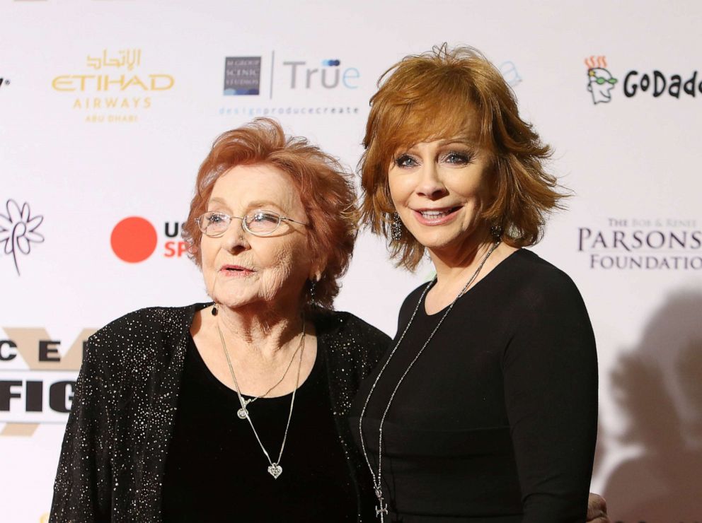 PHOTO: Reba McEntire and her mother, Jacqueline McEntire arrive at Muhammad Ali's 22nd Celebrity Fight Night held at JW Marriott Desert Ridge Resort & Spa on April 9, 2016, in Phoenix.
