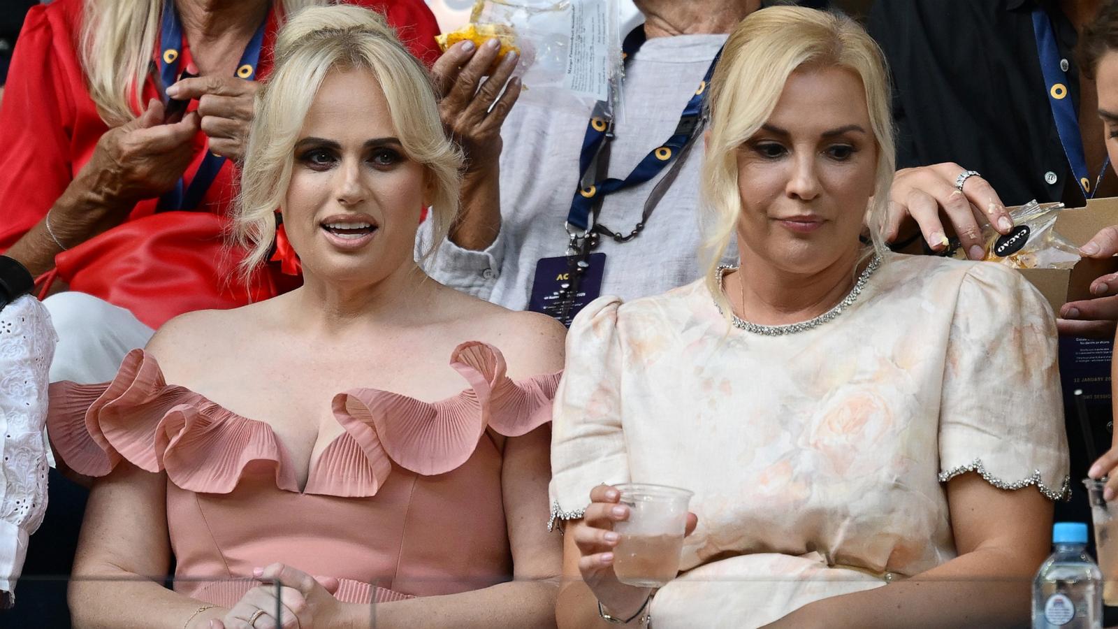 PHOTO: Rebel Wilson (L) and wife Ramona Agruma watch the Women's Singles First Round match during day one of the 2025 Australian Open at Melbourne Park on January 12, 2025 in Melbourne, Australia.