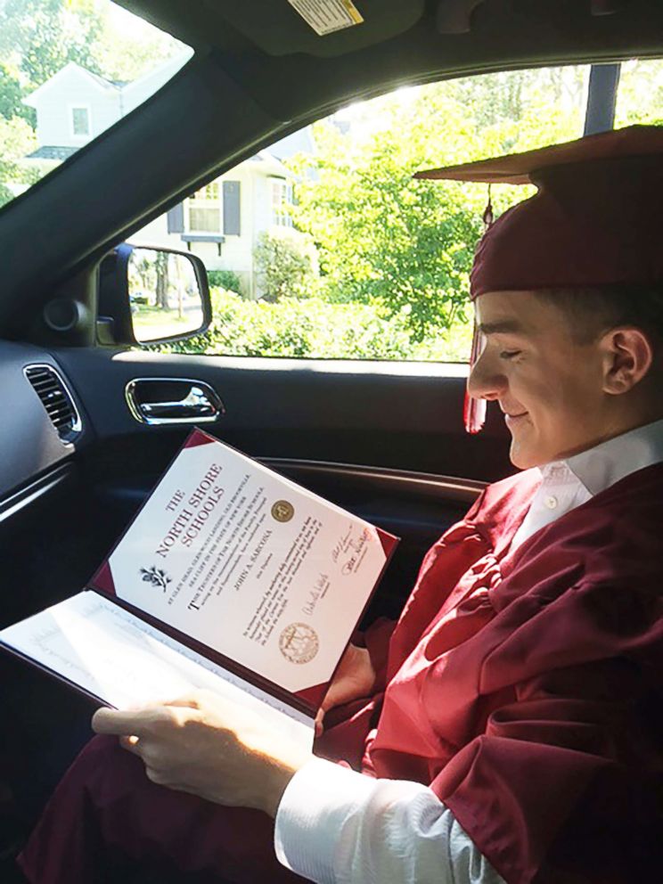 PHOTO: John Sarcona with his high school diploma.